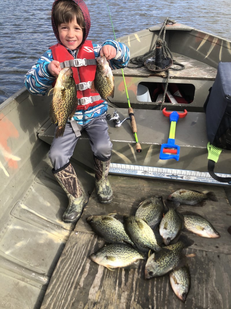 Boy with a lot of caught crappies.